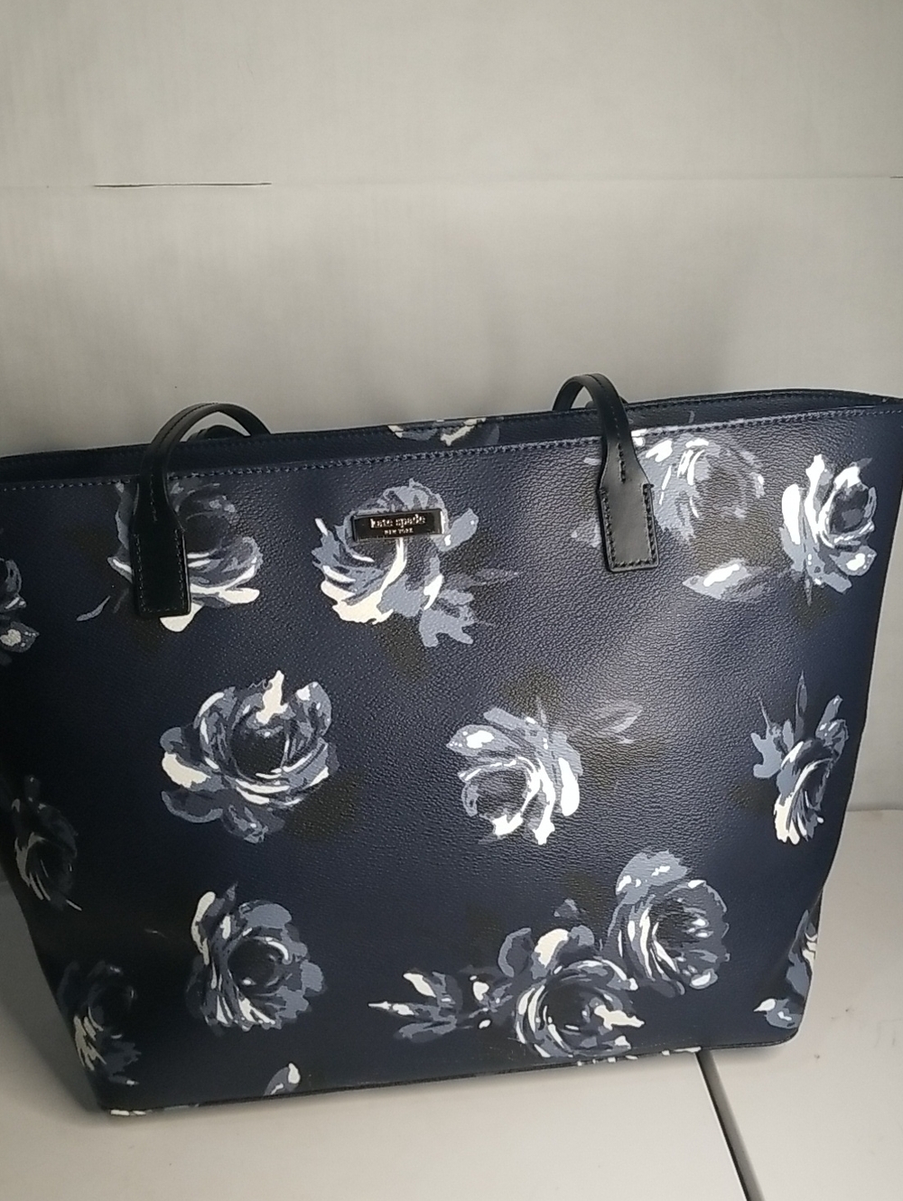 kate spade navy floral tote with white and gray roses